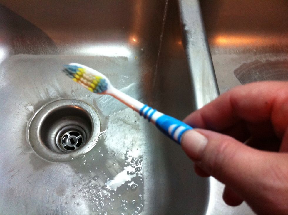If the old toothbrush's bristles are still good...