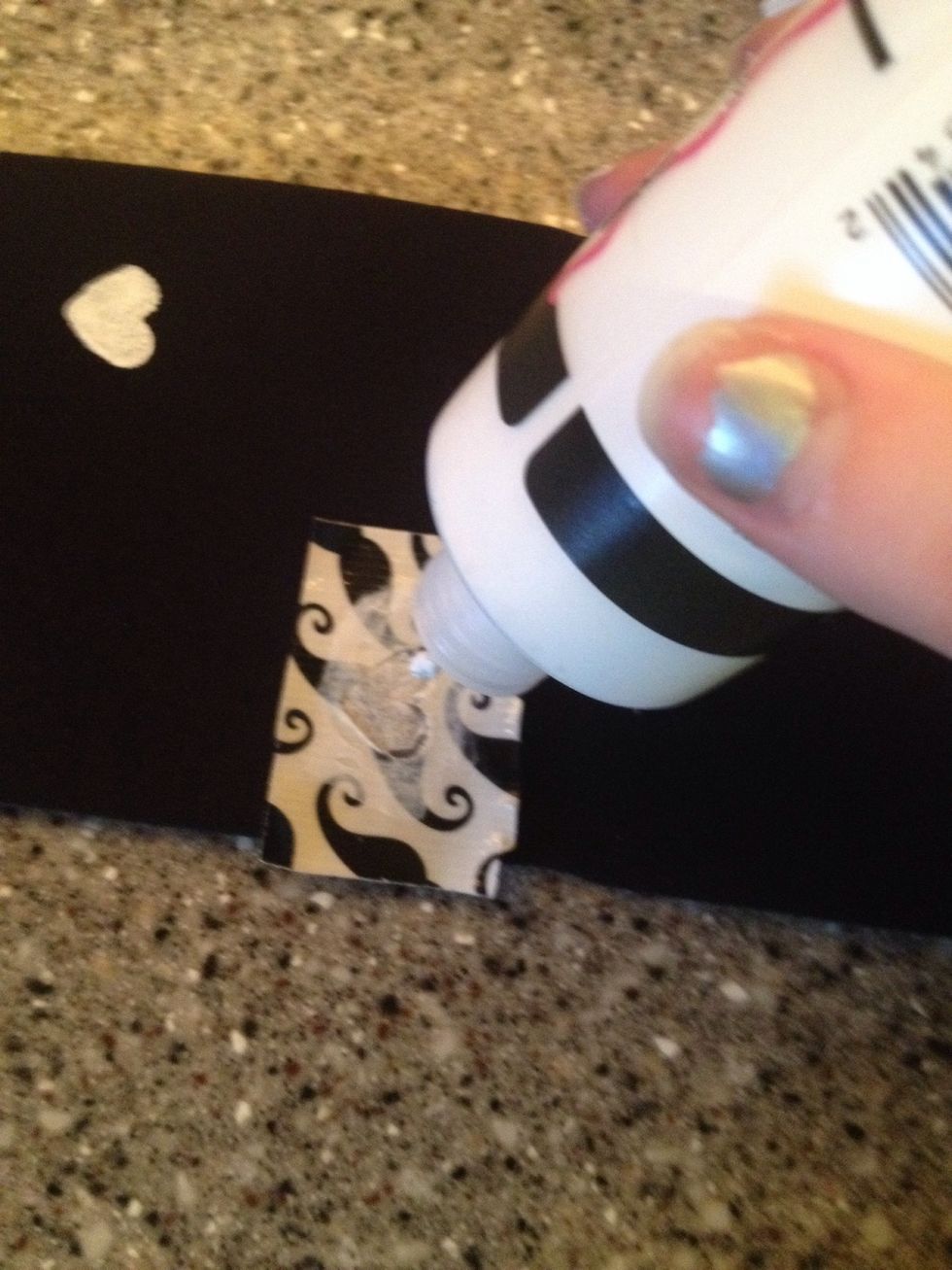 If the paint looks faded, streaky, or disfigured, put a new piece of tape back and put on a second coat.