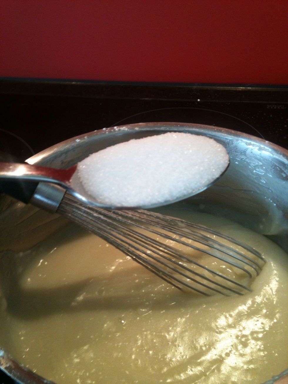 If the paste has this milky look and has no more flour lumps in it then let it cool down, just for a few minutes. After that add the sugar an stir it in.