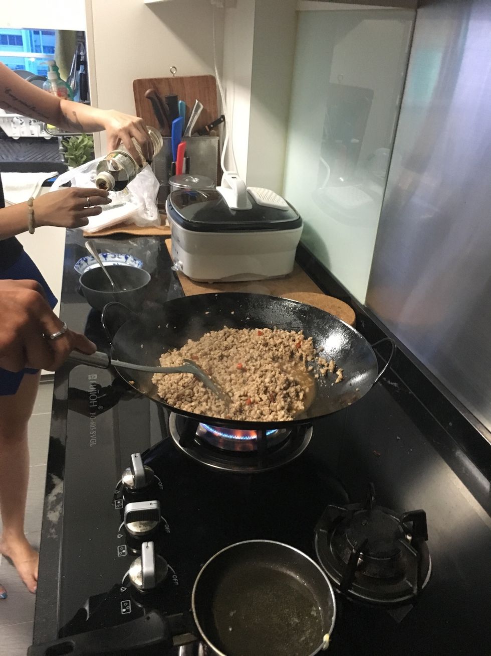 If the taste is barely there, add the next step; your light soy sauce. And followed by giving it a few good stir.