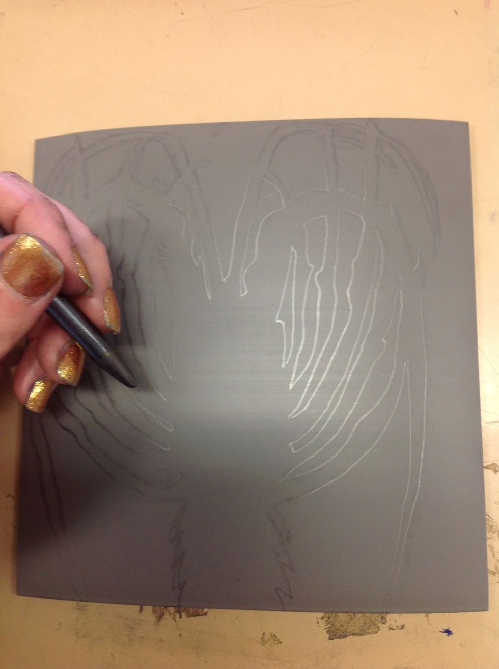 If the transfer is not dark enough to see well, go over the lines with a pencil or fine pen.