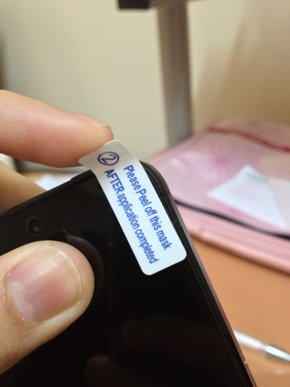 If there are no bubbles visible, you can now remove the protective cover (number 2).