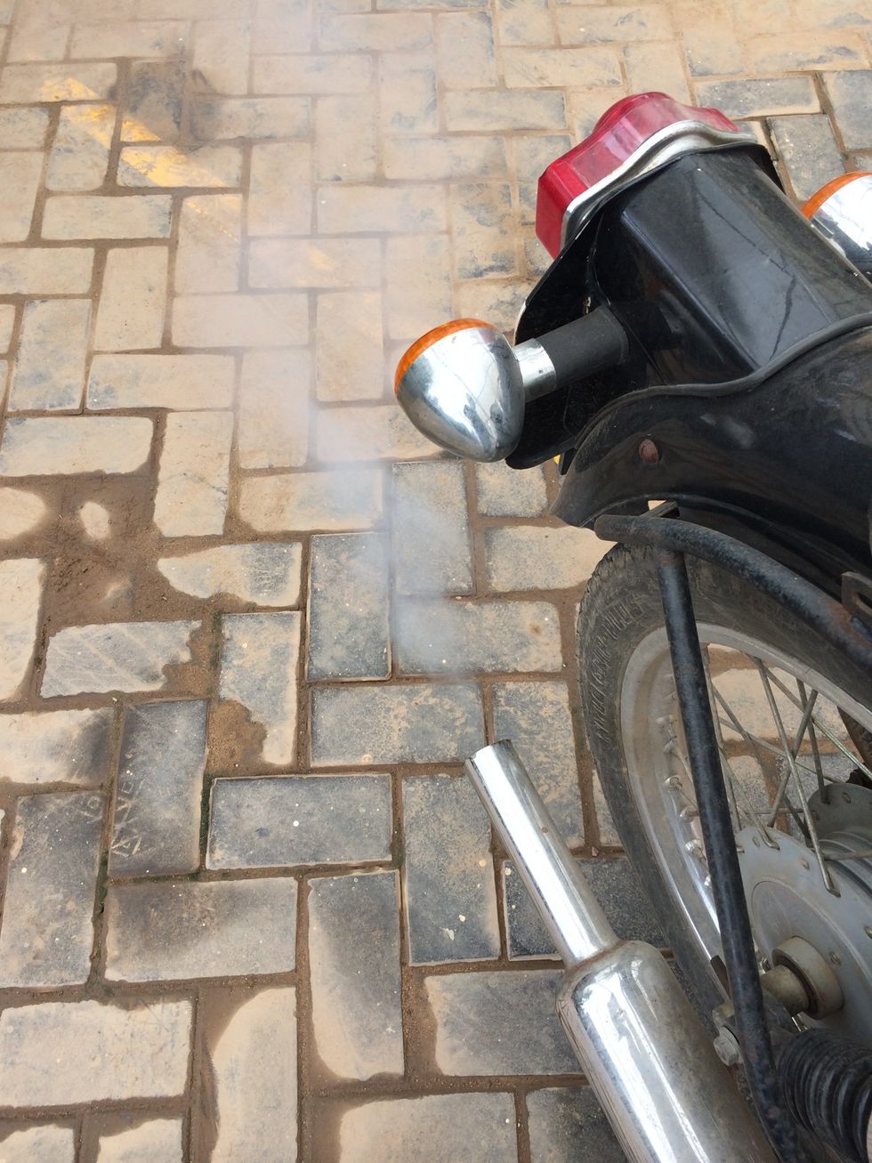 If there is white smoke from exhaust for few minutes after leaving a motorcycle unused for few days, then it could be wet sumping issue.