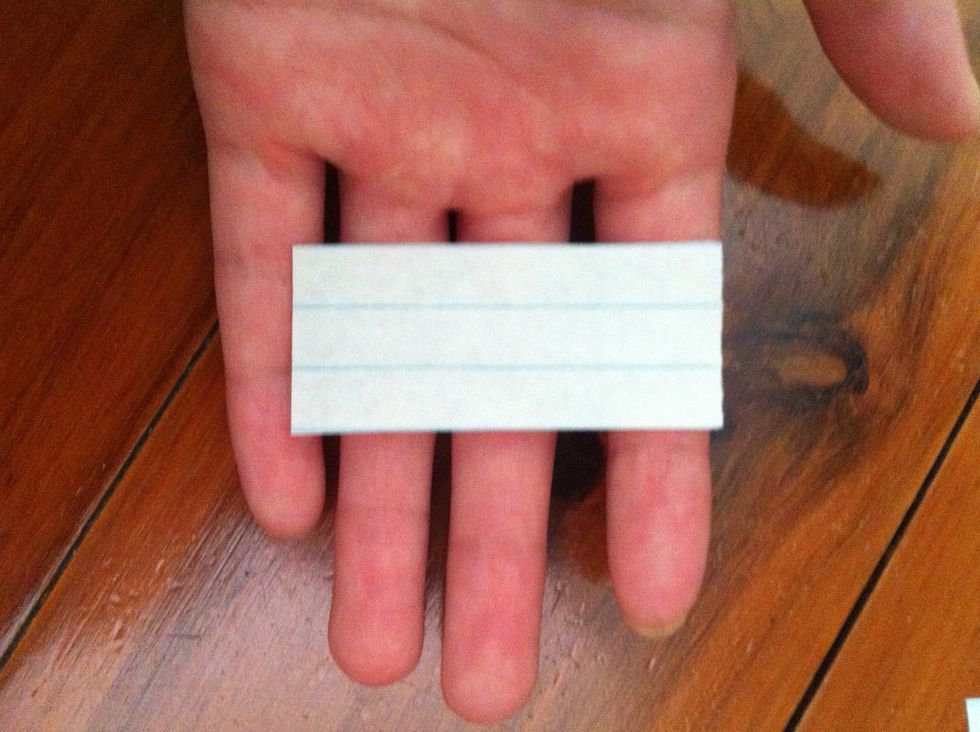 If u r using lined paper, cut it so that there r 3 lines like this (or if u want it bigger, then 6 or 9 or 12 or 15 ...)