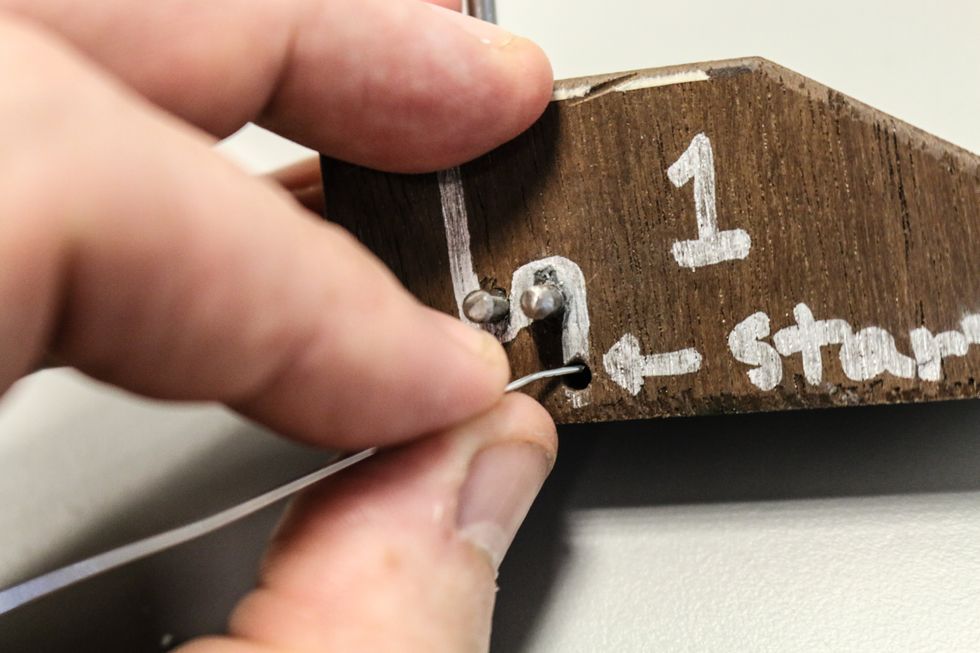 If using a jig (we'll post a how-to-make a jig soon to the end of this how to) start the wire by putting one end in the hole marked "start" on the "1" side.