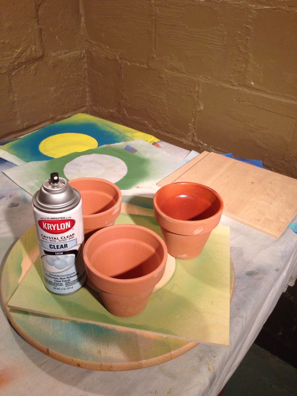 If using pot for plants, spray inside of pot with a couple coats of clear spray paint. The sealant will help protect the paint from pealing and make your pots last longer.