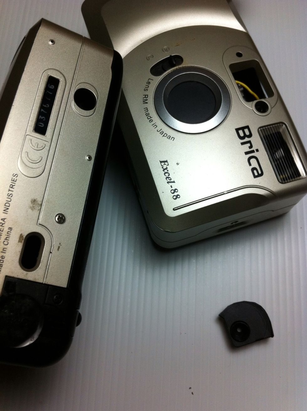 If we have old analog camera pocket, we can use mounting screw to combine with rubber dop as tripod mounting