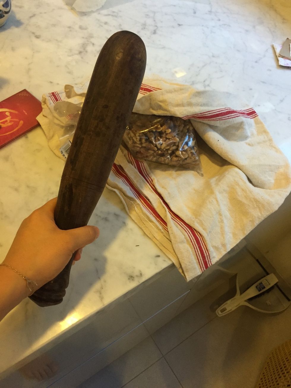 If ya didn't buy chopped walnuts, don't bother actually CHOPPING them. Pour them out onto a thick cloth, hold the opening tightly closed and give them a good bashing \ud83d\udd28 - but not into powder!!!