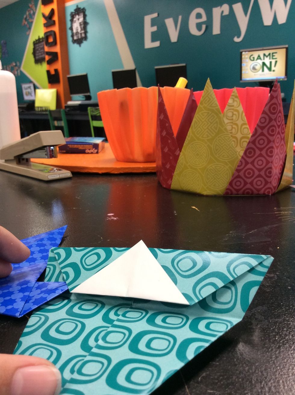 If you are having difficulty doing this you can also unfold it to put the piece in and then refold but this harder and I recommend only doing it if you understand what i am describing.