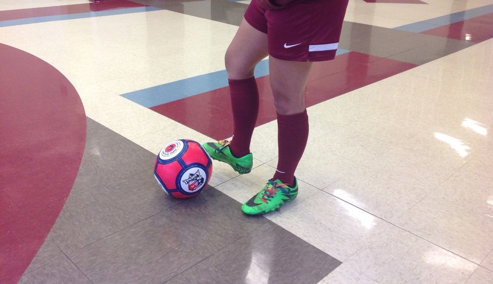 If you are right footed, your left foot is going to be right next to the ball (it's the first step you take) And lock your ankle