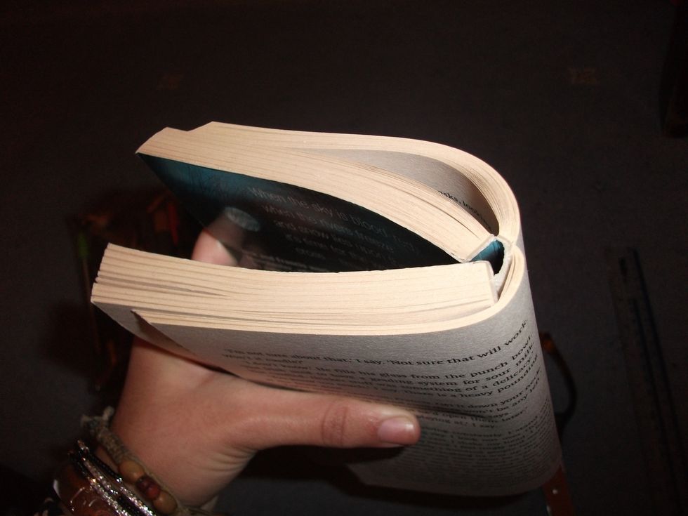 If you are ripping pages from a book I find that bending it back a lot really helps to rip them out easier. Do it so the spine practically doesn't exist anymore.
