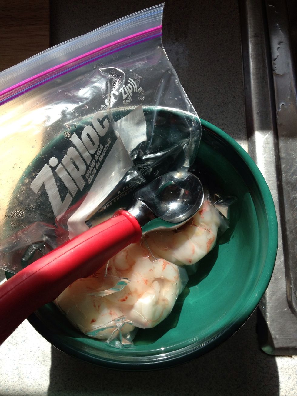If you are using frozen shrimp, you gotta defrost it. Put the amount you want in a ziplock, seal tight. Dunk in a bowl of warm water with opening of ziplock not submerged. Leave over night