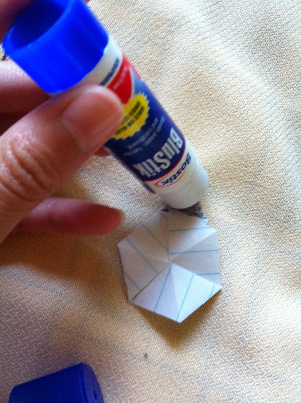 If you are using glue, then put glue on the black triangle