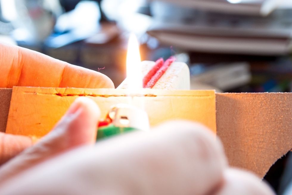 If you are using polyester thread you might want to burn the ends to keep them from fraying. Be careful not to burn or mark the leather.