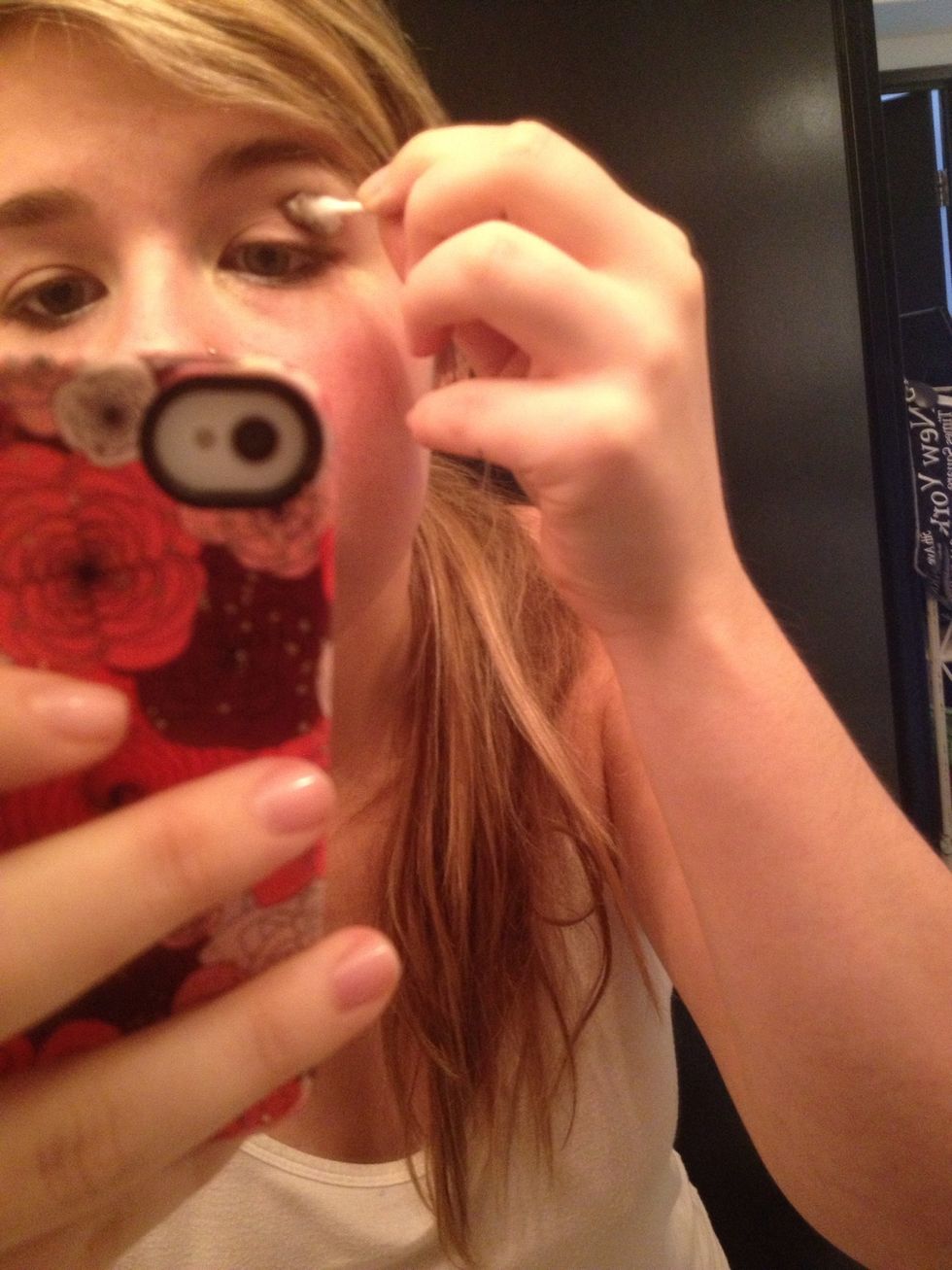 If you chose a dark color lightly run the Q tip along your crease line in the center downwards following the crease