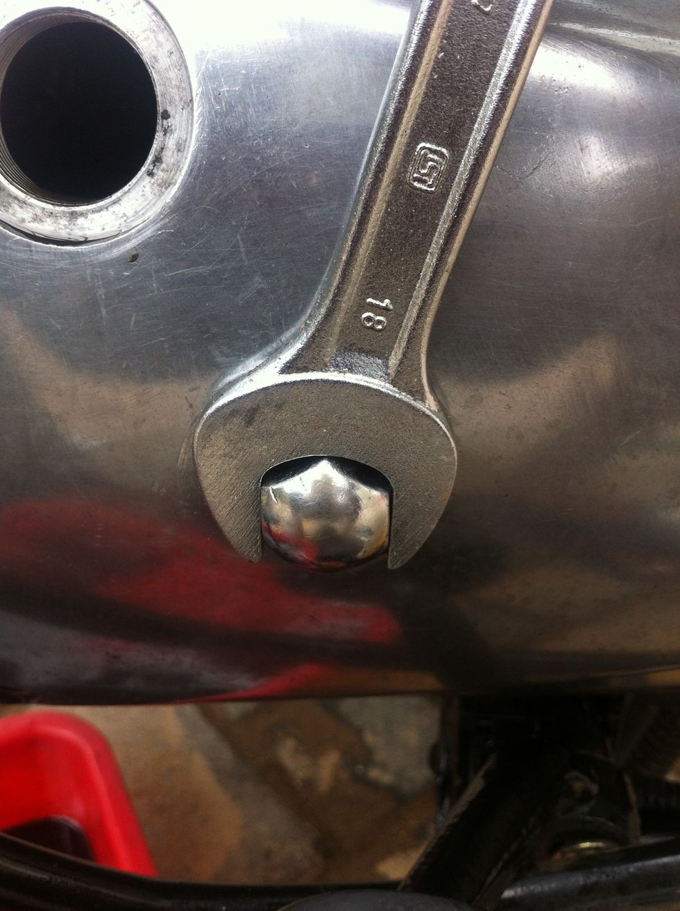 If you decide to tighten the primary chain then remove this main bolt using a 18mm spanner rotating anti clockwise.