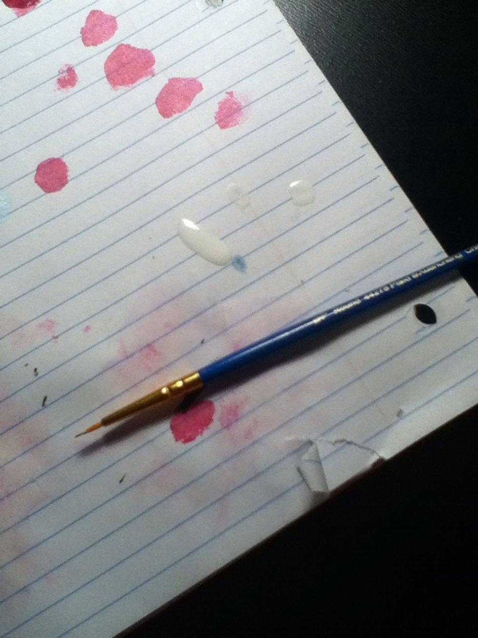 If you do not have a nail art brush you can either use a dotting tool or a toothpick dipped into white nail polish (I found this in a set of ten at Wal-Mart. They are just small brushes)