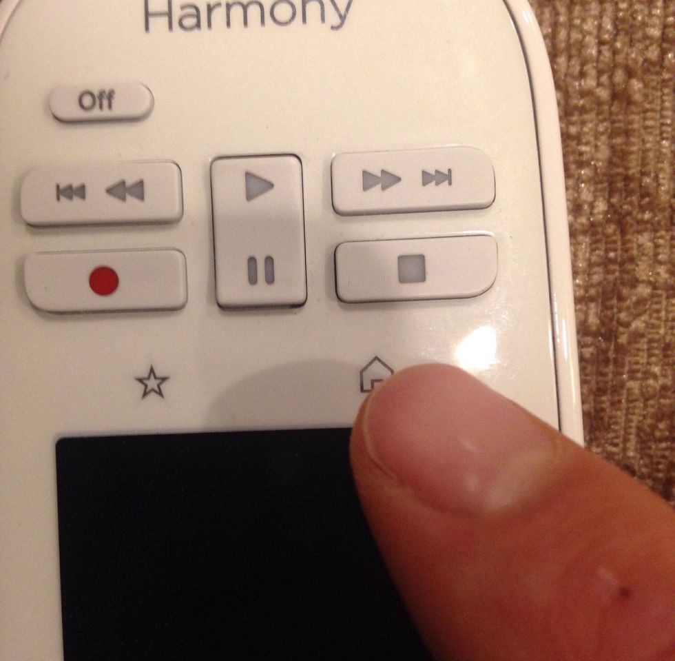 If you do not see "Watch Apple TV", then press the 'house' image