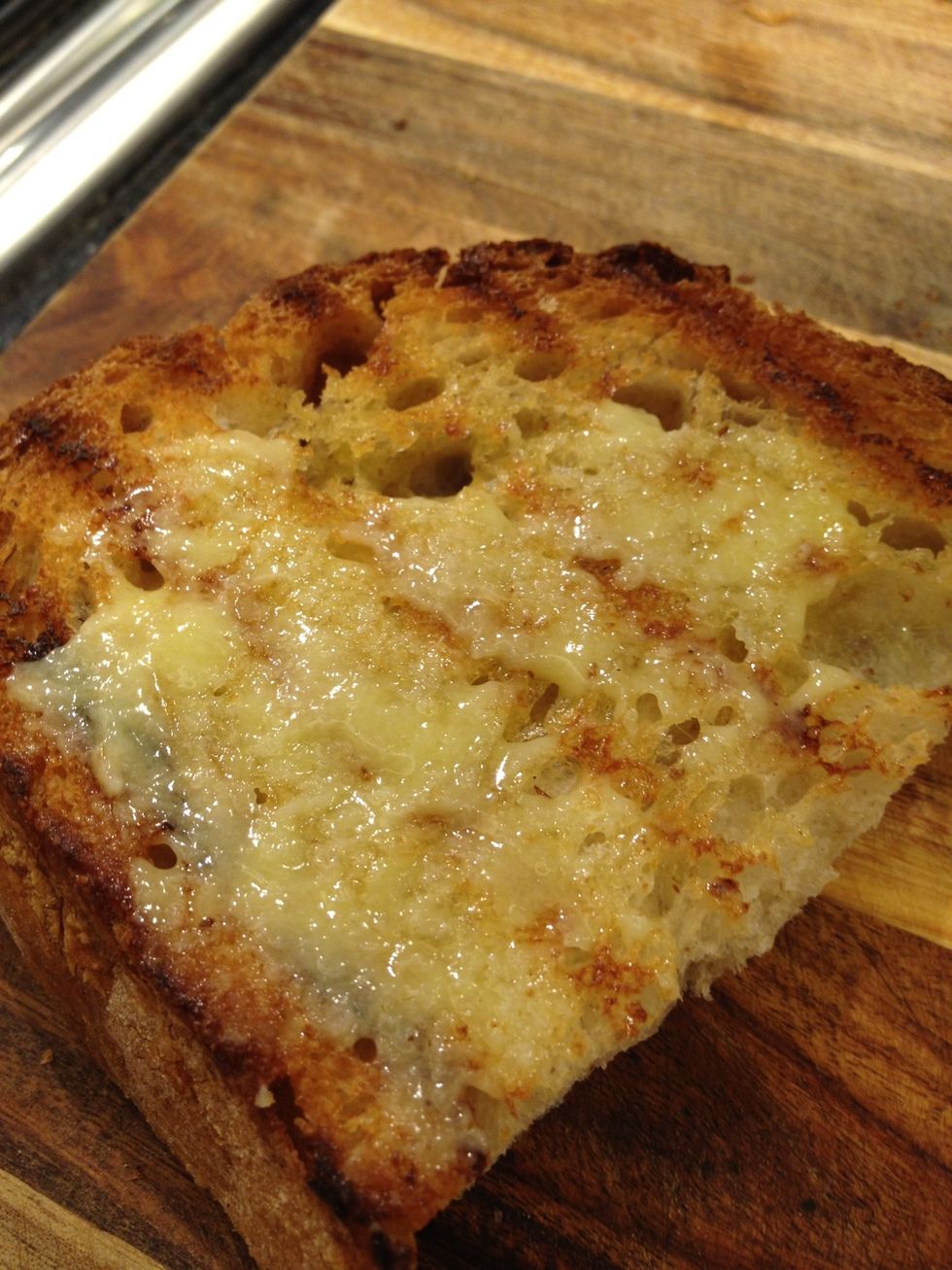 If you don't like the taste of raw garlic, spread first and then grill it or put it in the oven