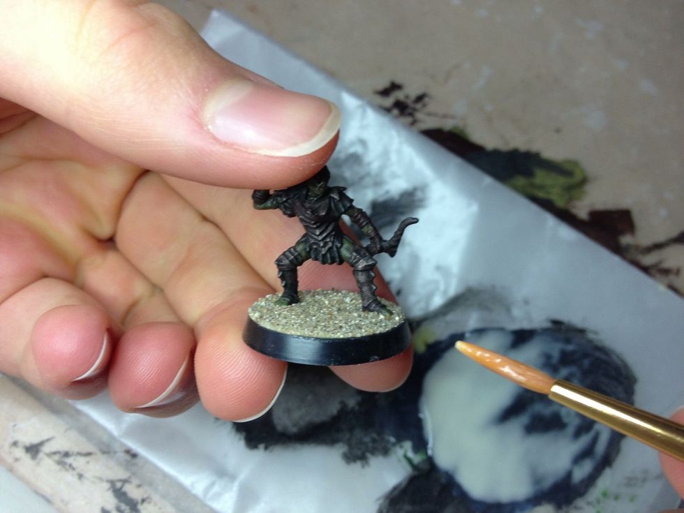 If you happen to get any on the model itself, rinse your brush and while it's damp, use it to remove the glue from the miniature.