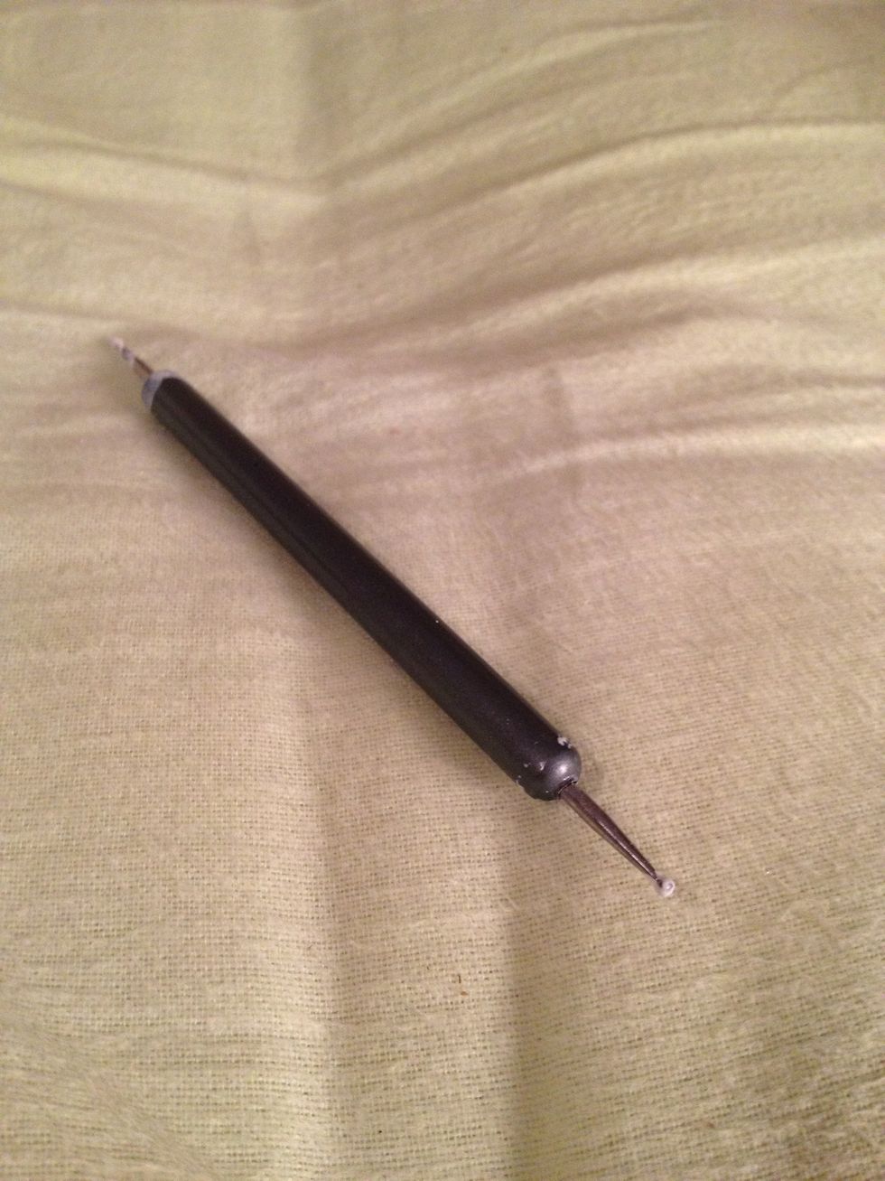 If you have a dotting tool, use it to make little stars with your white nail-polish. If you don't have one, the end of a pen or even a toothpick will work just fine.