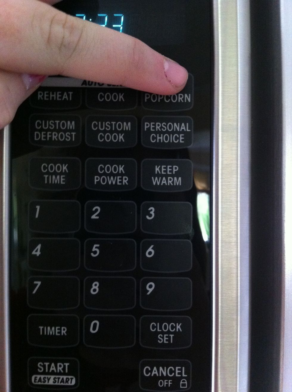 if you have a popcorn button, press it. if not, put the popcorn in for  about 1:45-2:00 minutes
