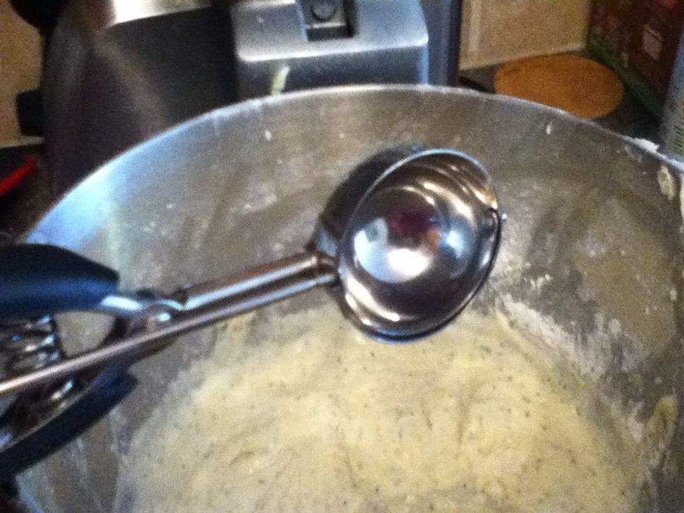If you have an ice cream scooper, it makes filling the liners easier. If not try using a large spouted measuring cup.