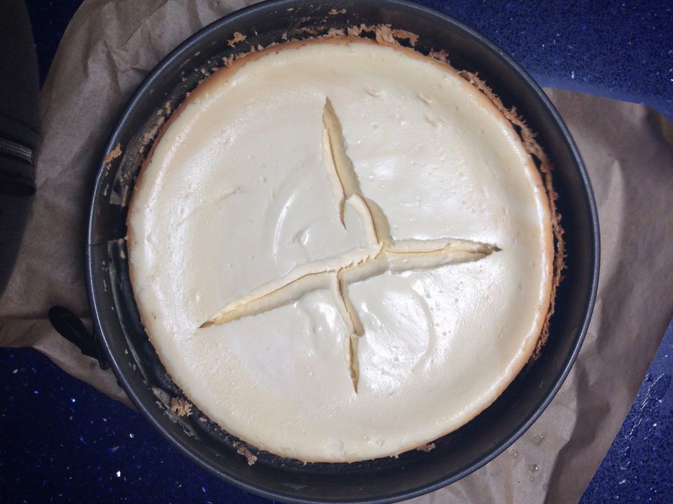 If you have done a thorough job separating the cake from the sides of the pan, you will see that the pan opens up around the cake.