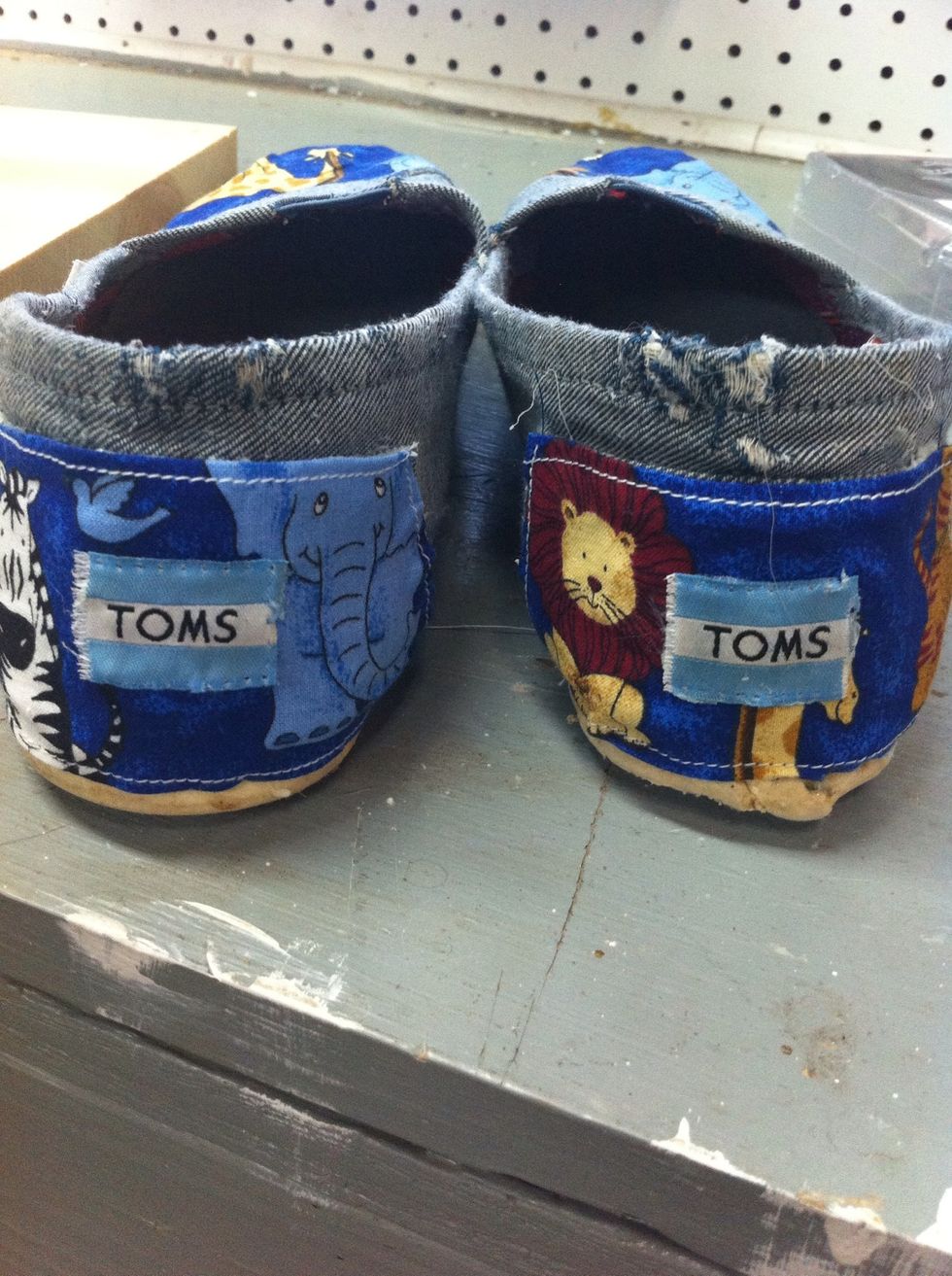 If you have removed the TOMS logo, lightly glue the logo over your fabric. You can leave it off if that's how you roll.