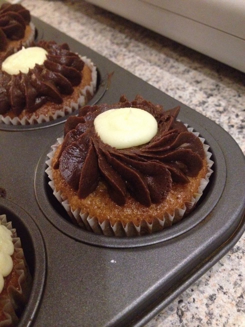If you have some vanilla frosting left after frosting your blueberry muffins; use it on the banana cupcake!