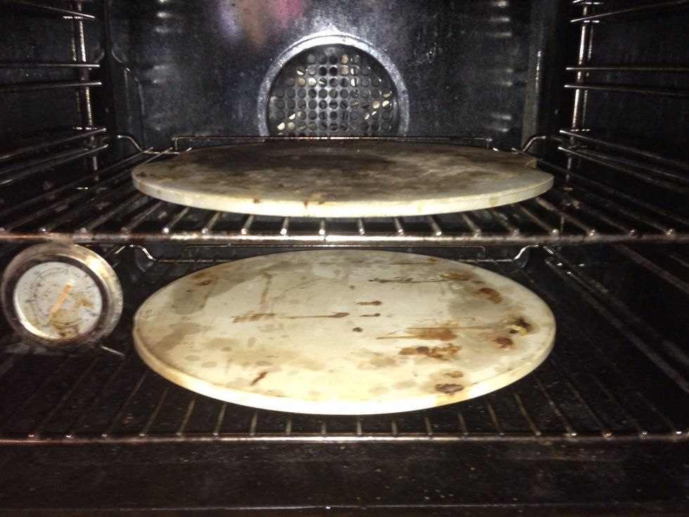 If you have two pizza stones place them in this order  It works like a small pizza oven Cooking from the top and bottom at the same time .Preheated oven to 250\u00b0c