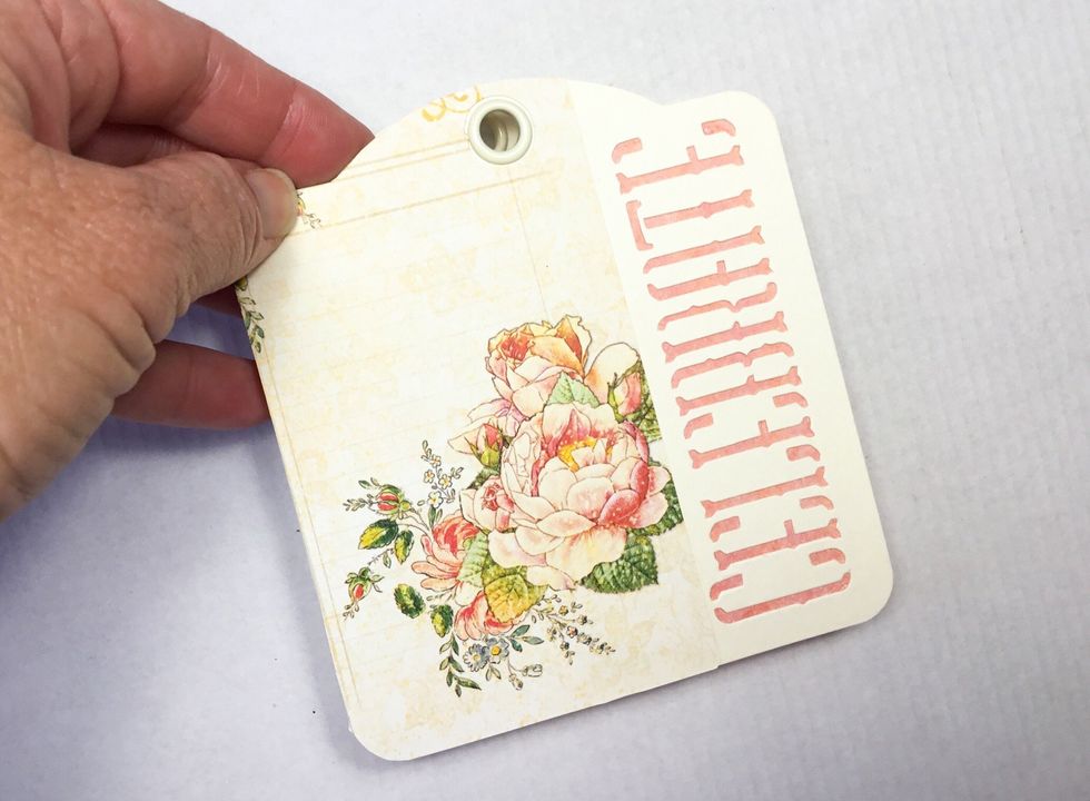 If you have used the same tags I have attach your choice of pattern paper to the front and behind the word on the front. Make sure to trim the pattern paper to be a nice snug fit around the word.