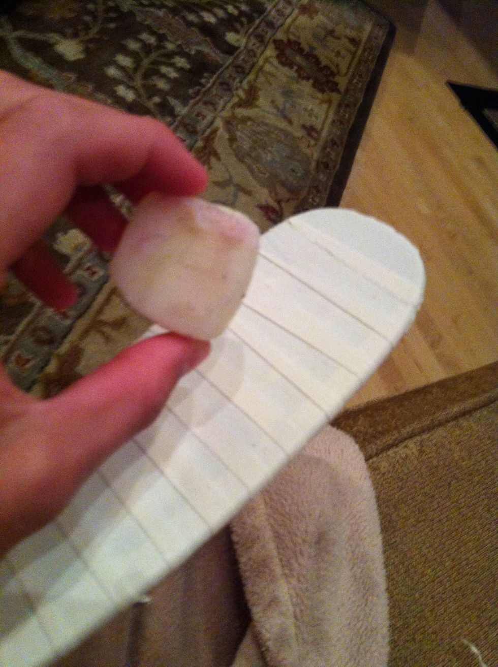 If you have wax, cover the whole stick with it, backside, frontside, and the bottom so it's nice and sticky.