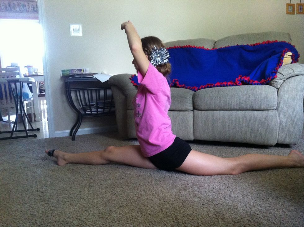 If you have your splits down. Try to hold it with your hands off the ground. Try to stay in the center and streach through your legs for support.