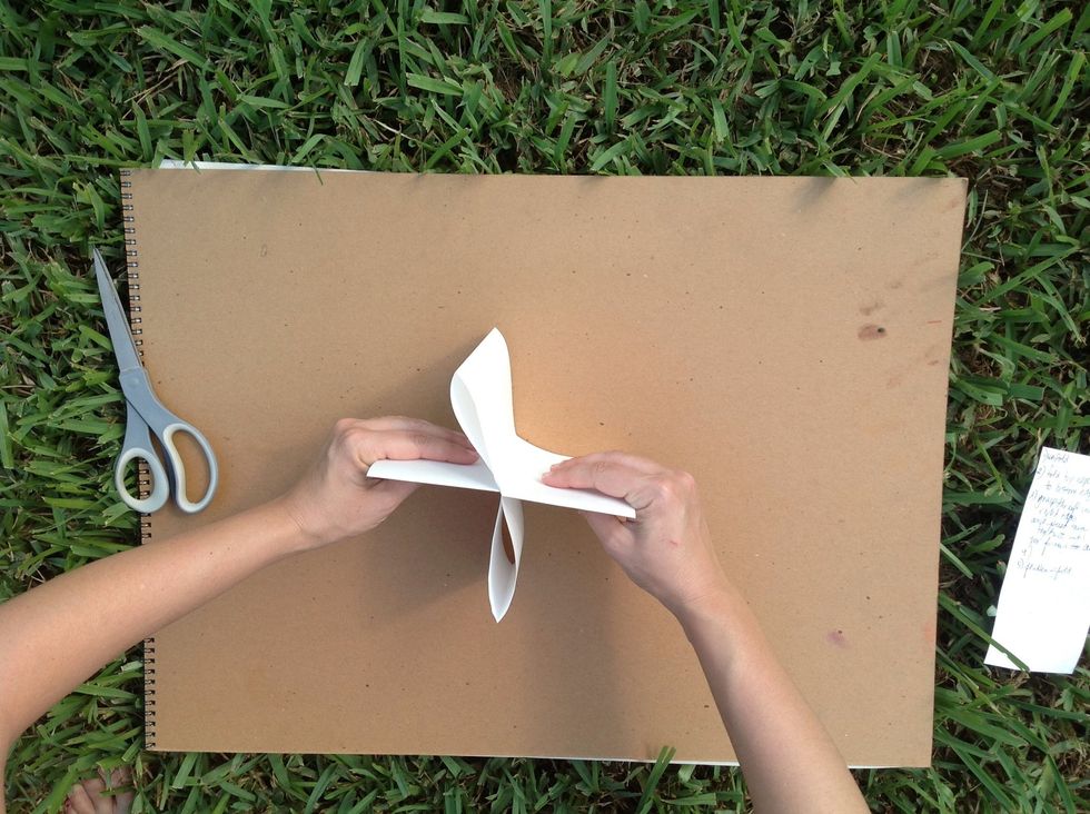 If you look at it from the top it should look like an x or a cross.