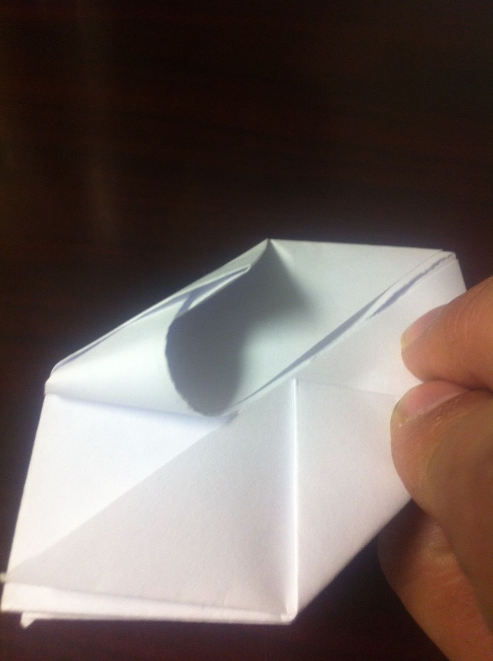 If you look closely at the side tabs each has a slot and a corner above it. Fold each corner down and slide it as far as it will go into the slot.