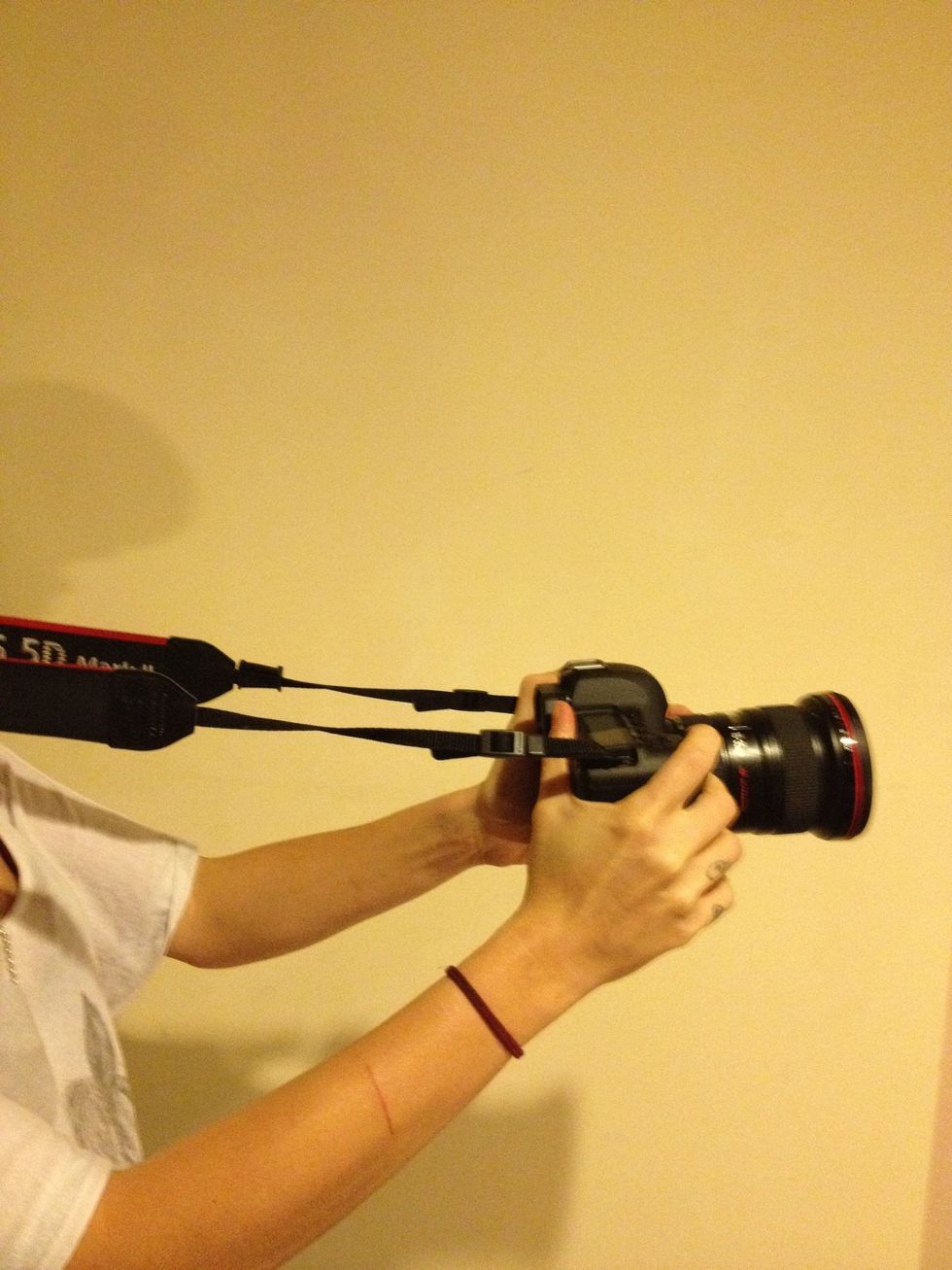 If you must shoot handheld, put the neck strap on and hold the camera away from you so the strap is tight. This is suprisingly effective in steadying your shots.