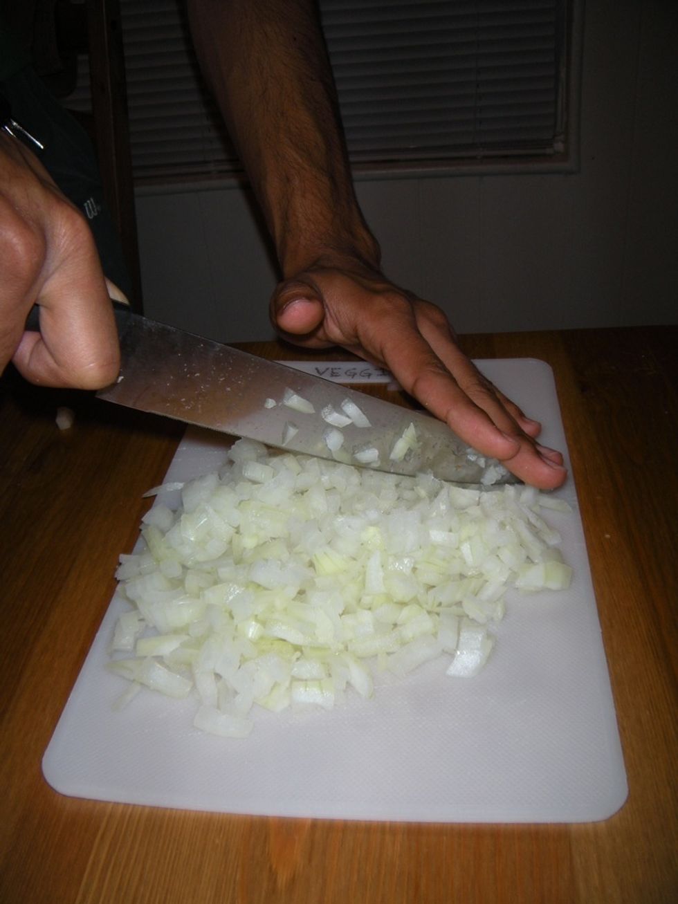If you need finely chopped onion: Hold the top of the tip of your knife in place. Chop down on the onion pieces repeatedly. Use a fan motion to cover all the area.
