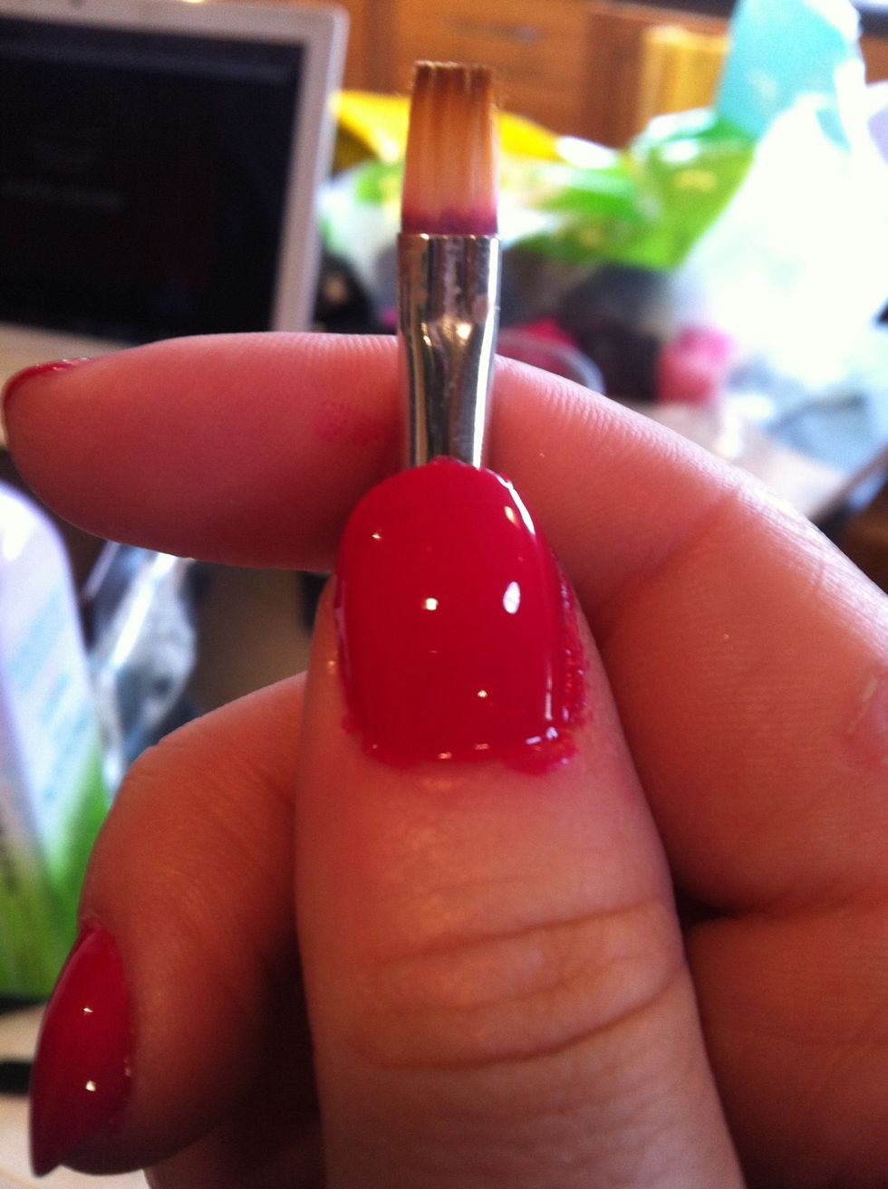 If you need to do any cleaning up around your cuticles, dip a flat brush in pure acetone and gently swipe the stray polish away. Wipe excess on a paper towel. This picture shows the "before"...