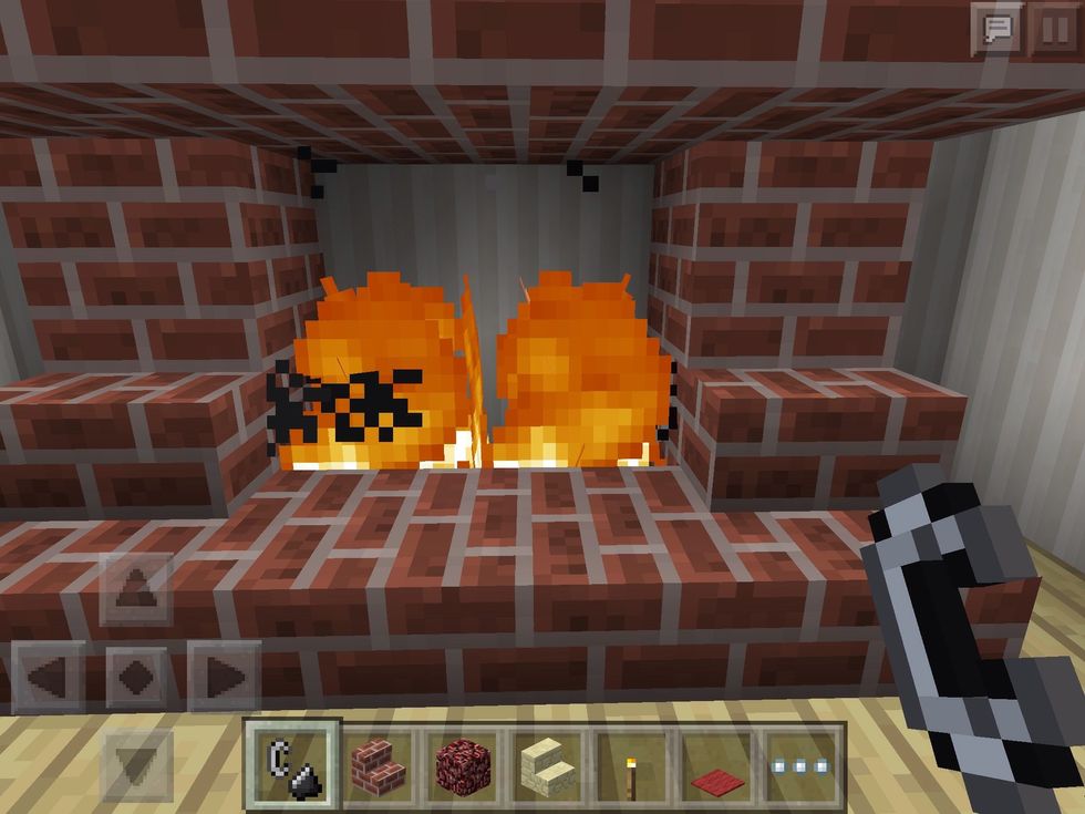 If you place netherrack in a hole inside the fireplace, and use flint and steel on it, it will ignite and stay lit forever! Perfect!