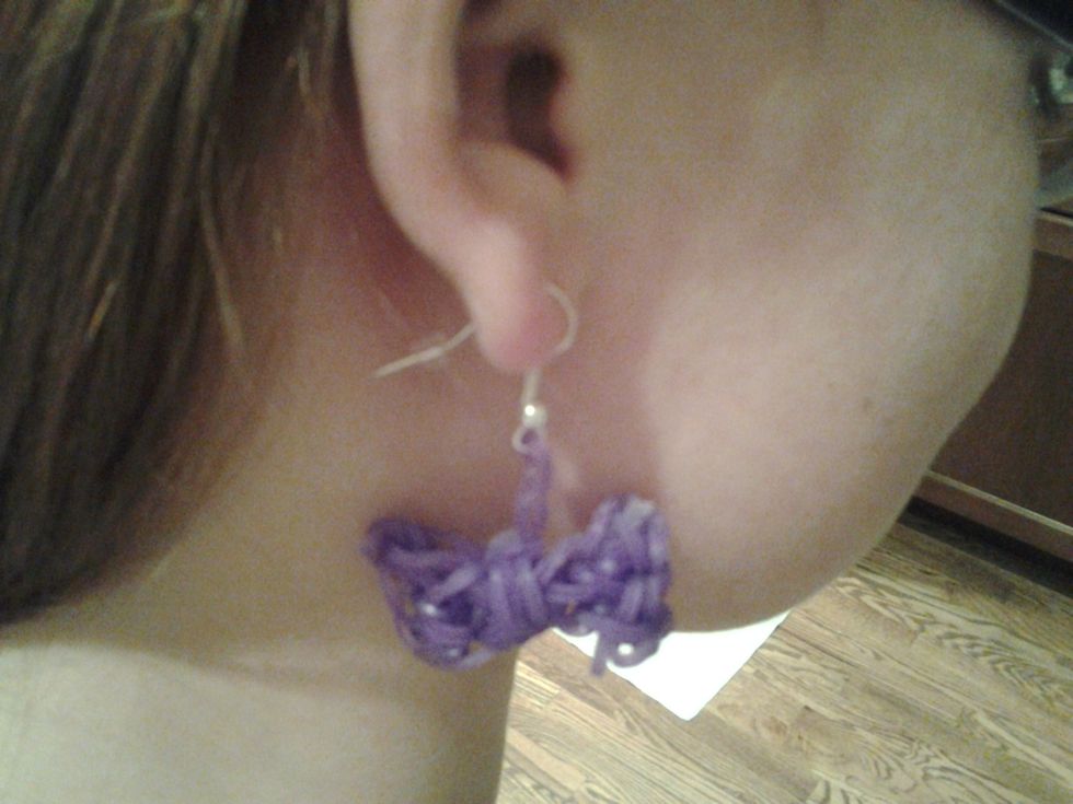 If you put the hook in your ear then take it out or leave in and have an adult help put the clasp on the back of the hook.