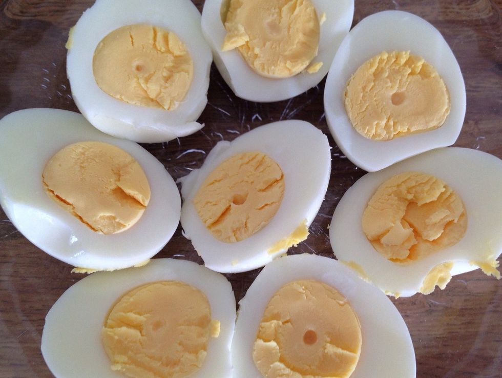 If you're into prepping, hardboil 8 eggs and then keep them cold. When you're closer to serving, cut each egg in 2 halves.