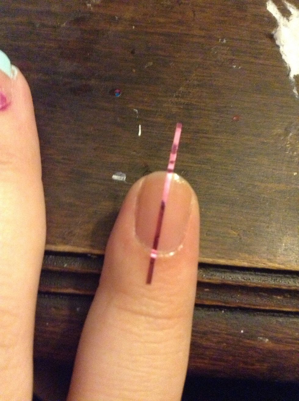 If you're using regular tape, just tape off one side of your nail.