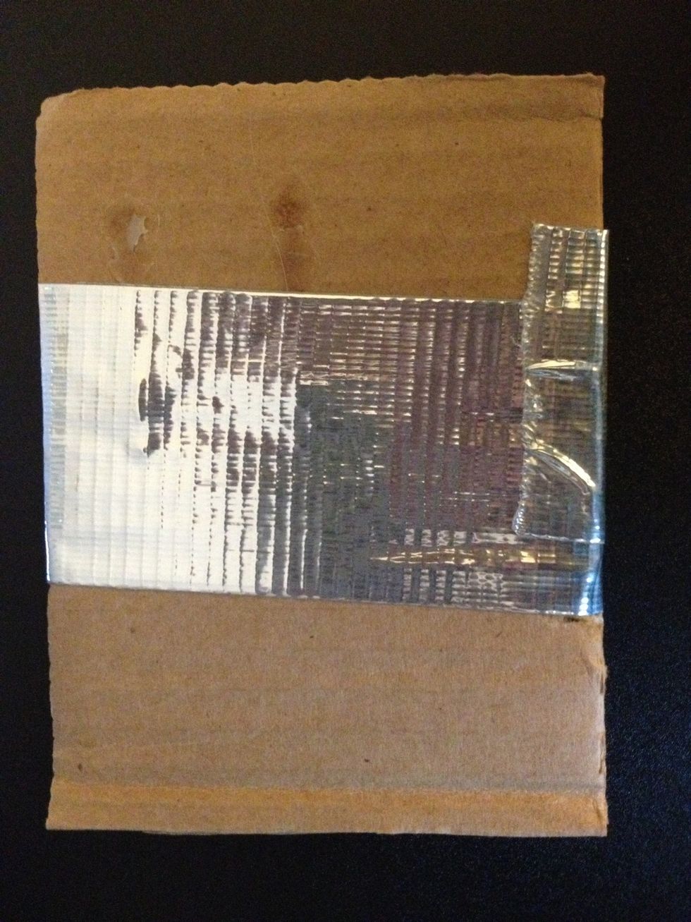 If you're using two pieces of cardboard, tape the two together, it doesn't need to be very neat.