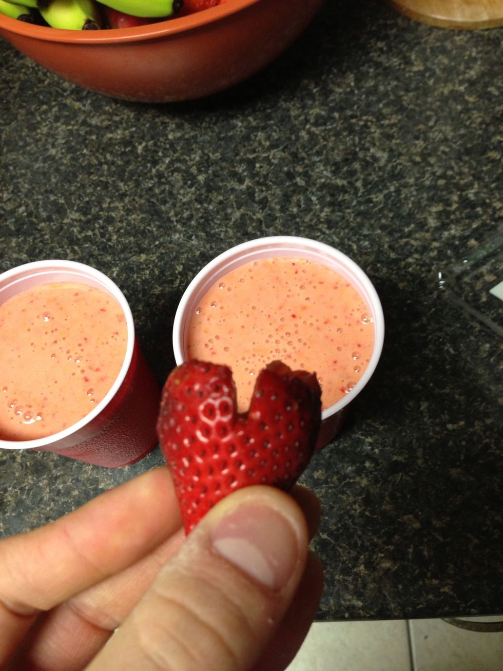 If you REALLY want to impress your friends notch out a little bit of your strawberries and place them carefully on the side of your cups for a fancy "restaurant-style" look. haha