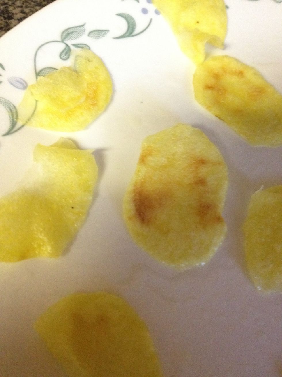 If you slightly burn them, it's okay! Put them in a bowl where all the finished chips are. Reduce the time. Once all your chips are as crunchy as you like them, put them in a bowl.