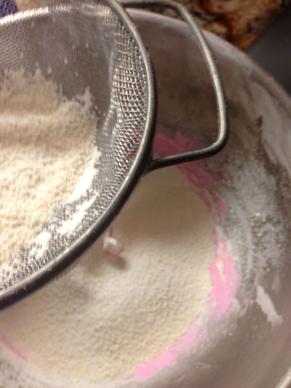 If you so desire, add some food coloring at this step (I used the gels), and then sift in the powdered sugar and almond flour mixture!