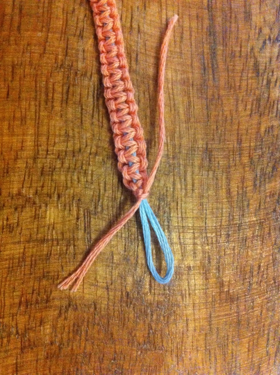 If you started on the side with the looped blue cord - once you are finished knotting (keep loop big enough so your button can pass through) tie the pink cords in several knots and trim ends.