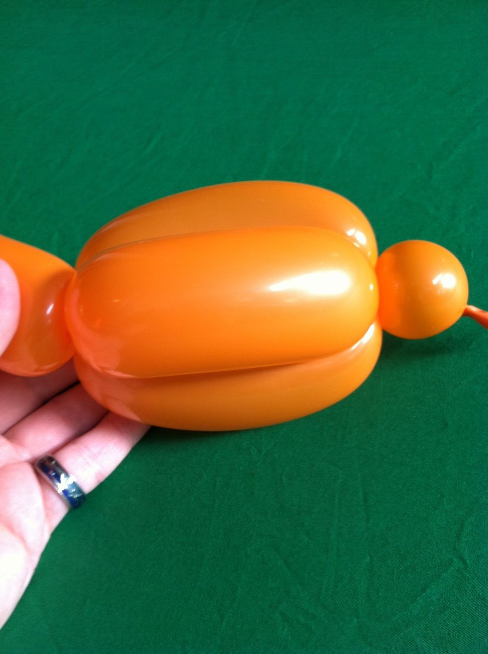 If you then take the stick and pull it down to the other end of the bubble pair, and twist a bubble slightly smaller than the bubble pair....