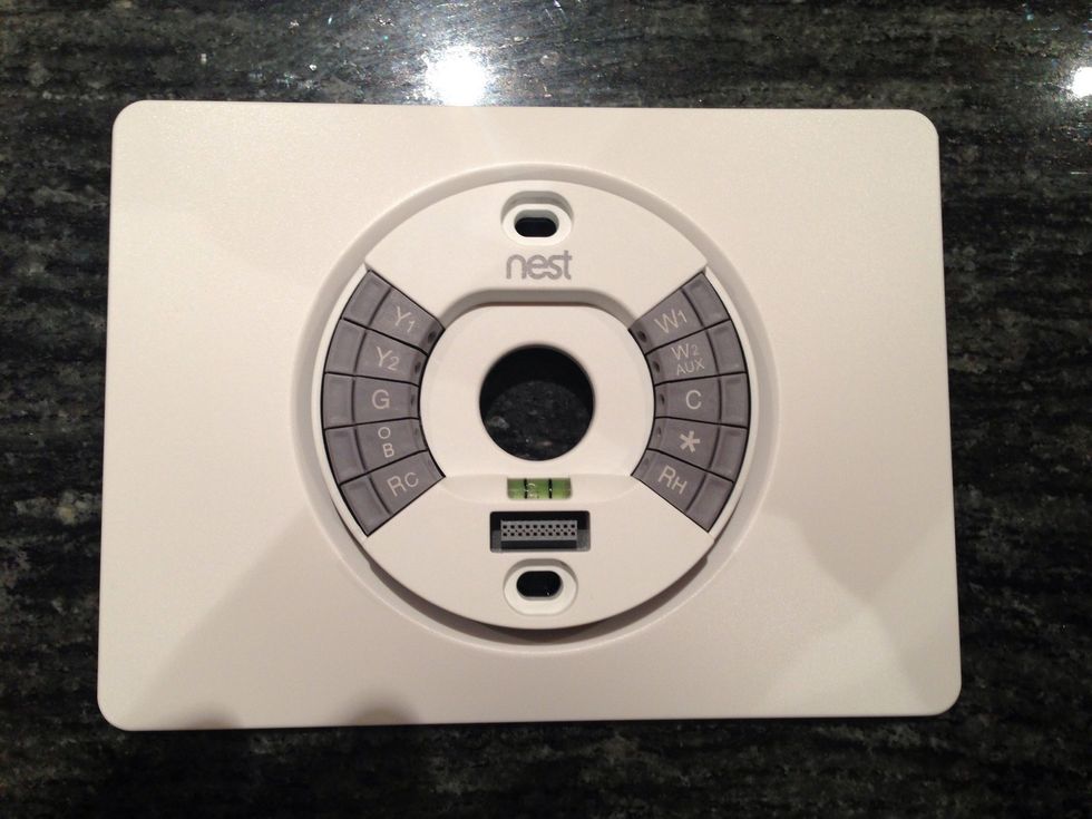 If you use the trim plate, place the base on top of the trim plate so that they snap together.